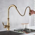 Elegant gold kitchen faucet with pull-down spray