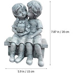 Boy Kissing Girl Statue Sitting on Bench Figurine