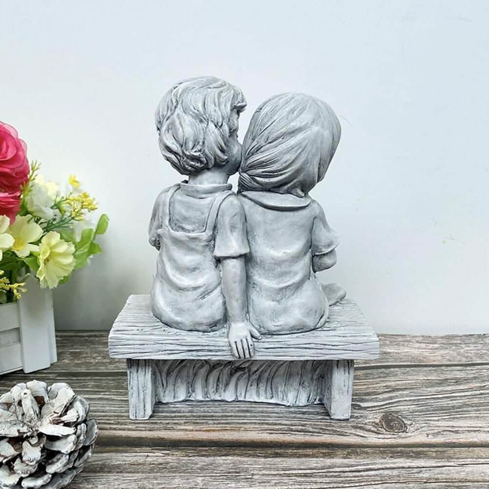 Boy Kissing Girl Statue Sitting on Bench Figurine