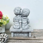 Boy Kissing Girl Statue Sitting on Bench Figurine