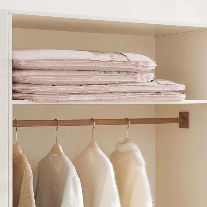 Hanging garment organizer with automatic compression