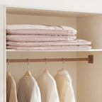 Hanging garment organizer with automatic compression