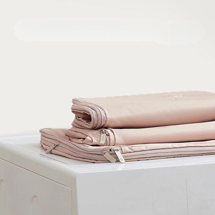 Hanging garment organizer with automatic compression